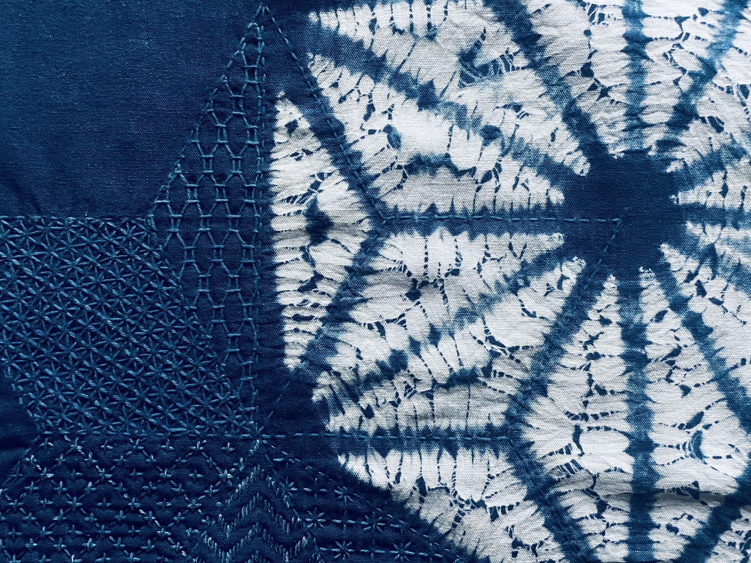 Asanoha nui-shibori in indigo with sashiko stitching worked over the dyed cloth